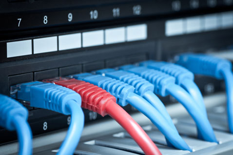 Close-up of a network hub, panel and cable.  Copyright: Kamil Krawczyk/iStockphoto